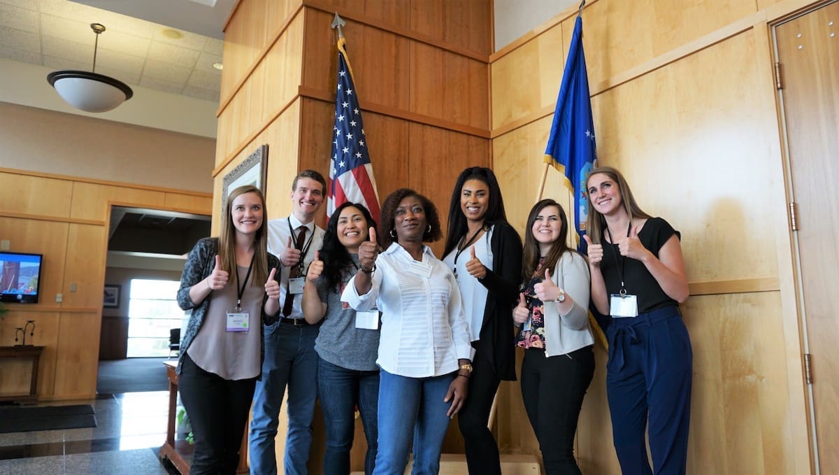group give the thumbs up