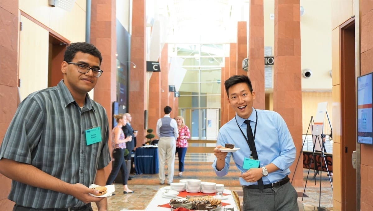 two guys at the dessert table