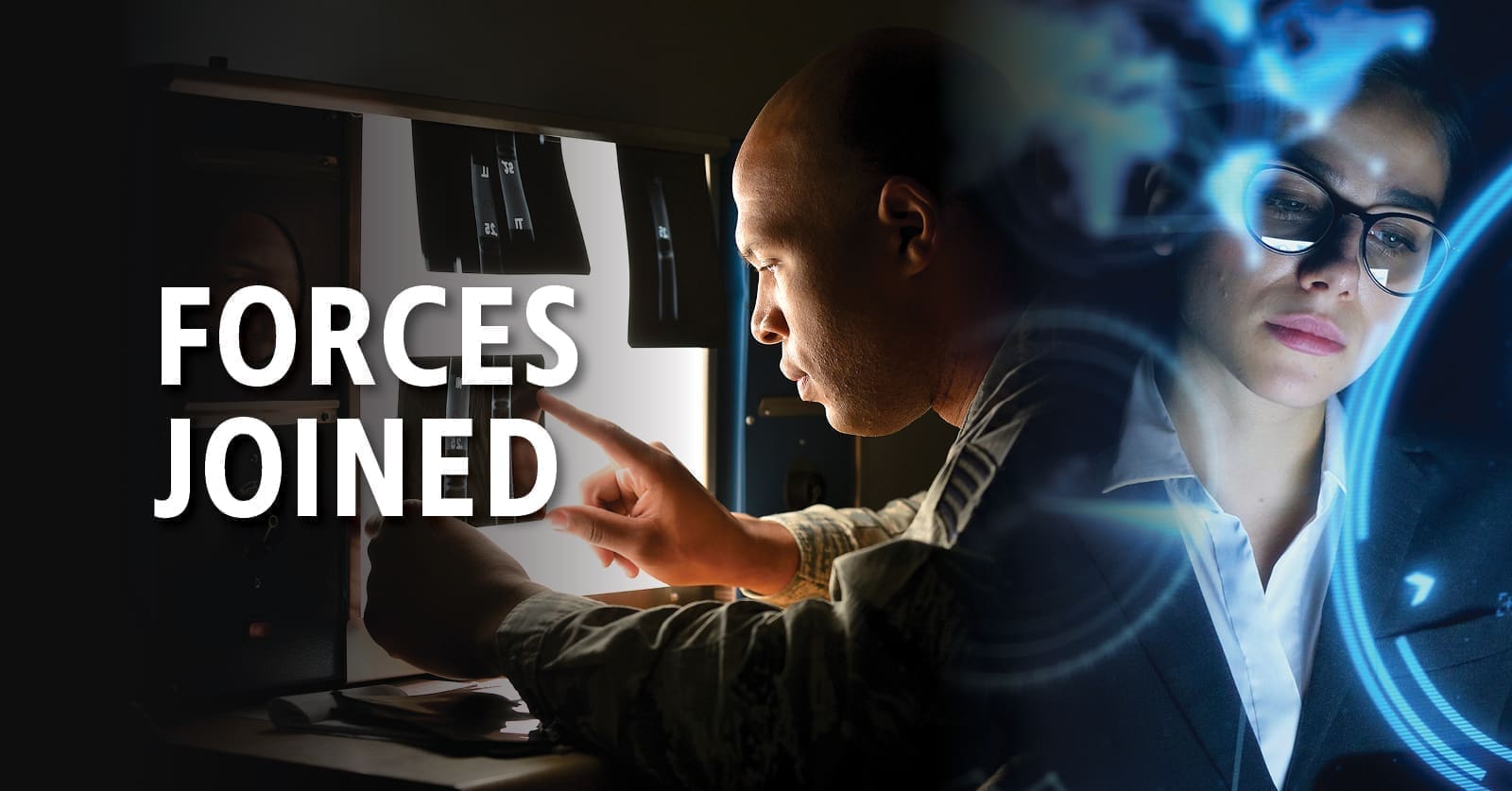 A man and a woman working at workstations with the text 'Forces Joined' on the left.