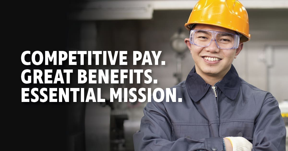 A man wearing a hardhat with the text 'Competitive pay. Great benefits. Essential mission.'