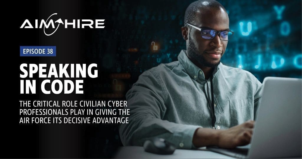 Aim Hire Episode 38: Speaking in Code, The Critical Role Civilian Cyber Professionals Play in Giving The Air Force its Decisive Advantage. A man wearing glasses with a computer screen reflected in his lenses.